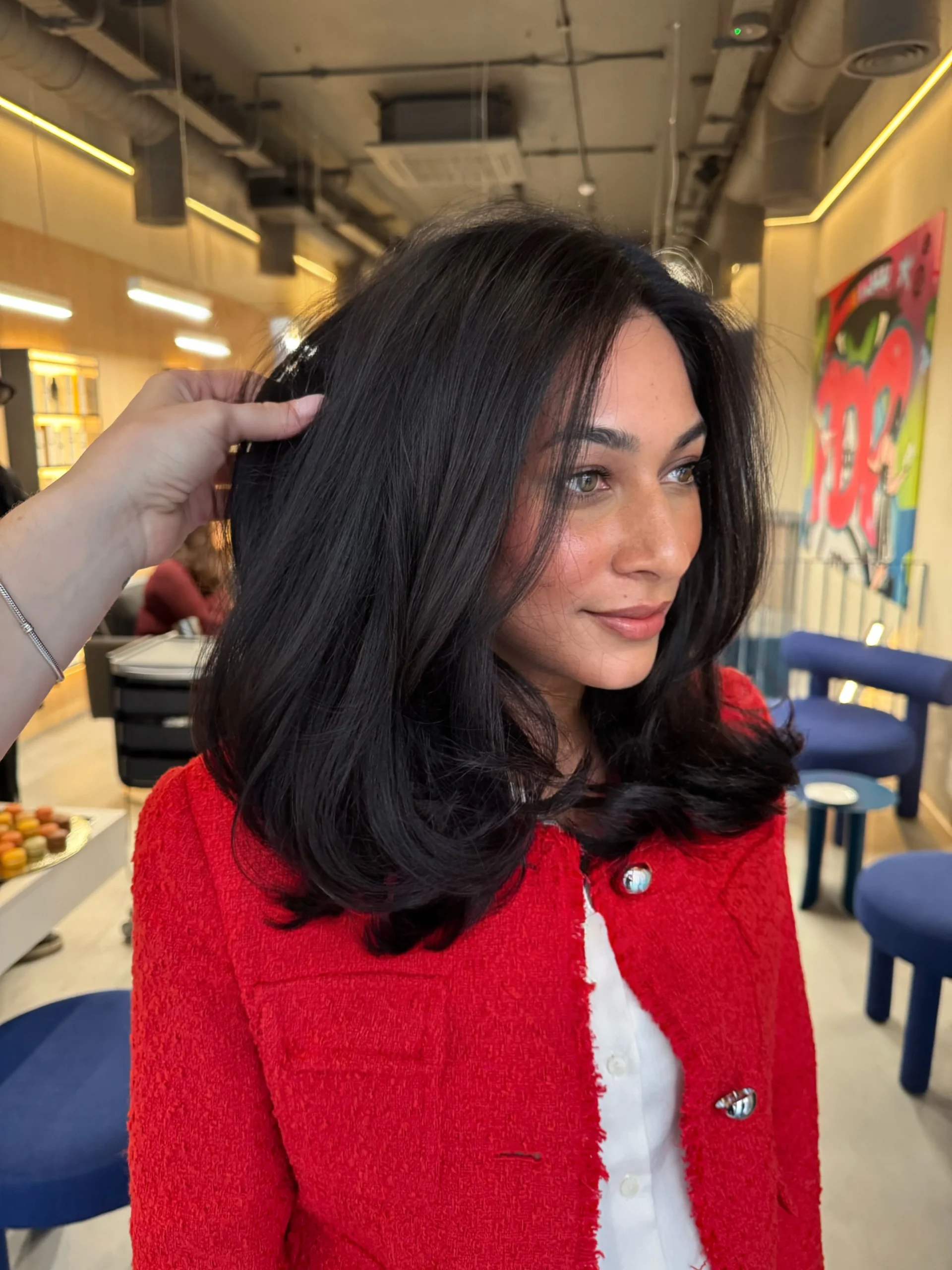 A polished appearance featuring professional hairstyling.